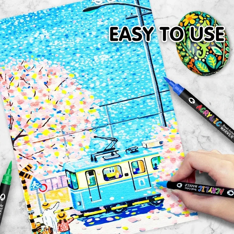 Coloring book with a tram illustration and acrylic marker pens being used, with text on ease of use and warm tips.